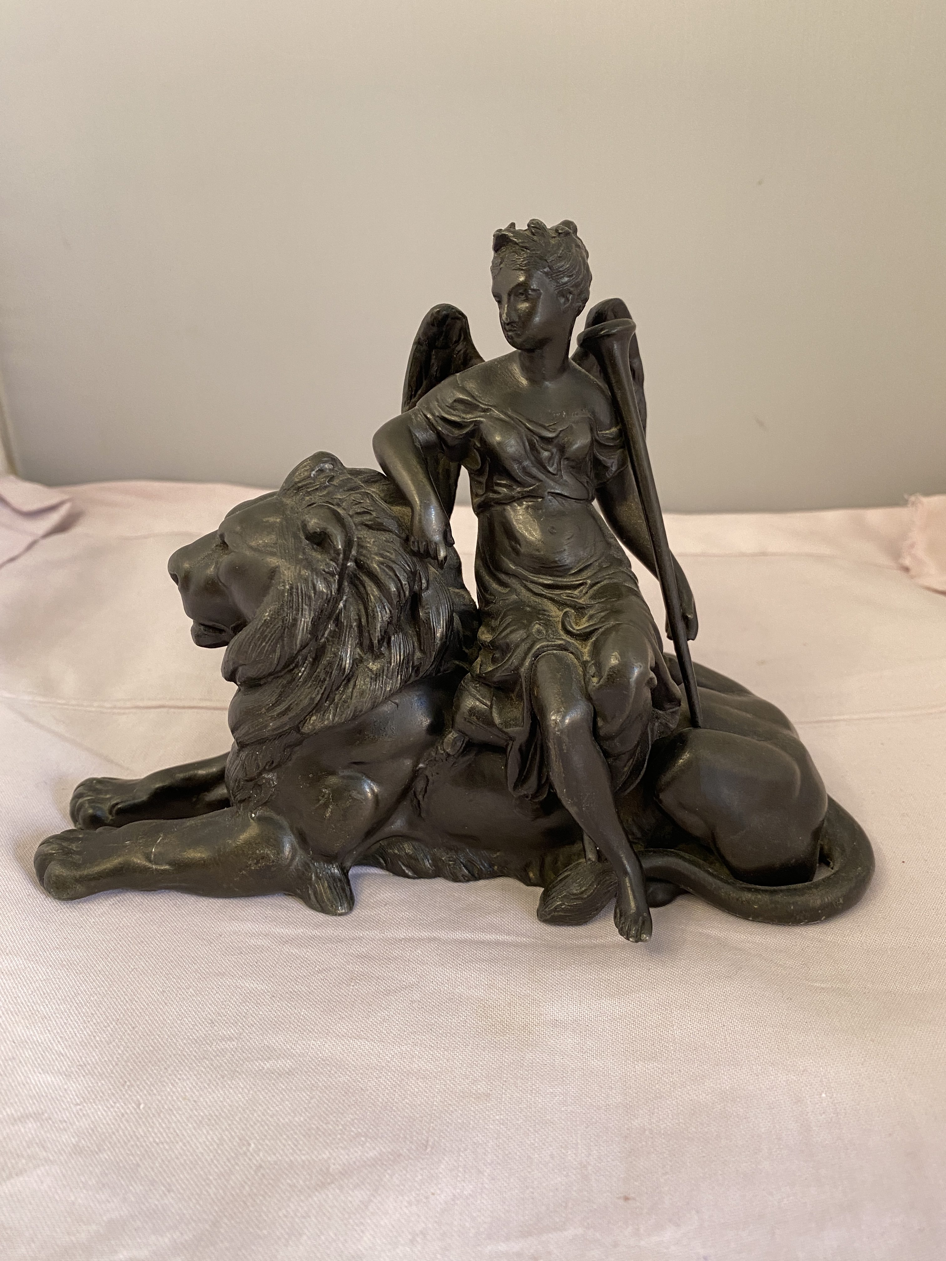 Victorian spelter angel sitting on lion (1318)