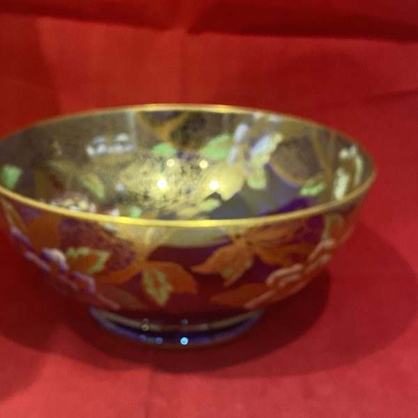 A beautiful Maling cobalt blue lustre Bowl decorated with Peony pattern gilded highlights and cobwebs